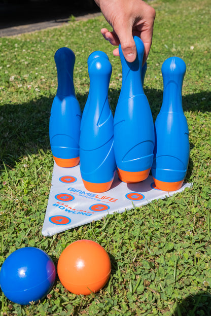 MagnaRack Bowling set for kids and adults is made to not blow over from the wind, the pins fall when hit!  Magnets on the bottom of each of the 10 bowling pins firmly stand upright on the included MagnaRack metal Bowling Mat to help your little bowler have more of a real bowling game experience.   Weather resistant molded Mini Bowling balls are designed to be used from the palm of your hand in grass, sand, or hard surfaces for kids bowling set boys and girls ages 6 and up.    